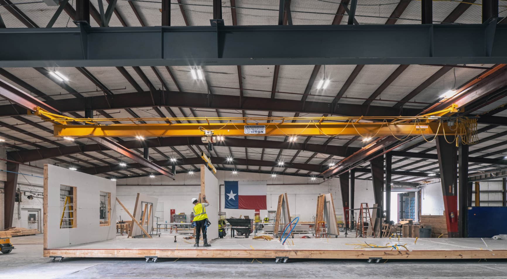 Cuero facility with Texas flag in background