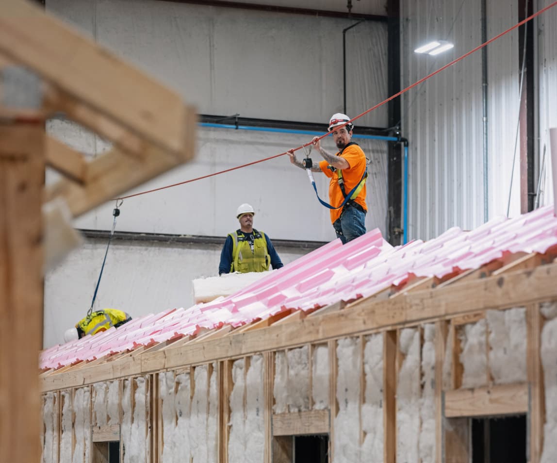 Two men working on roof