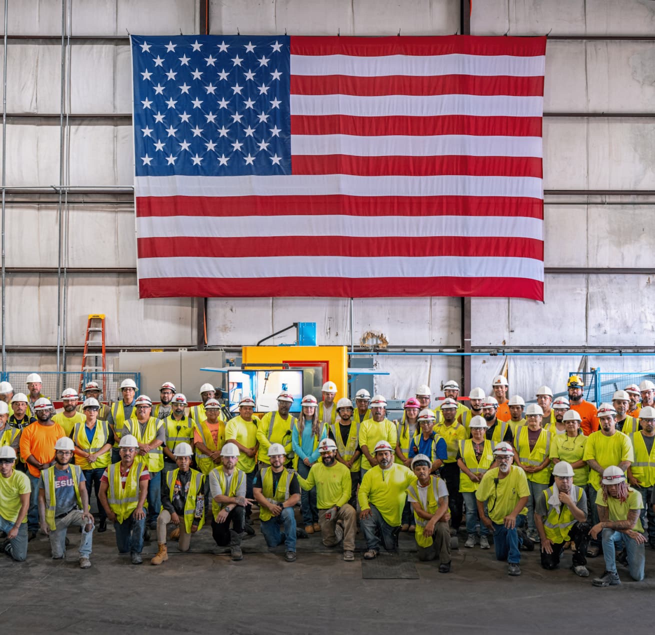 Cuero team posing in factory